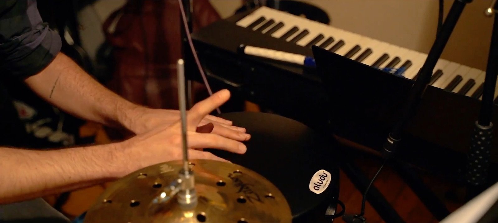 A hand on the cymbal