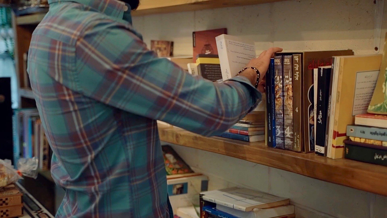 Taking a book from the shelf