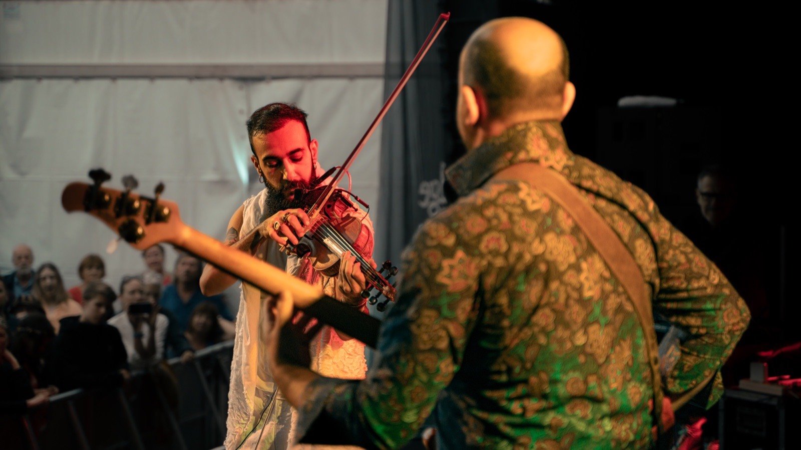 With the guitarist, in front of the tent crowd