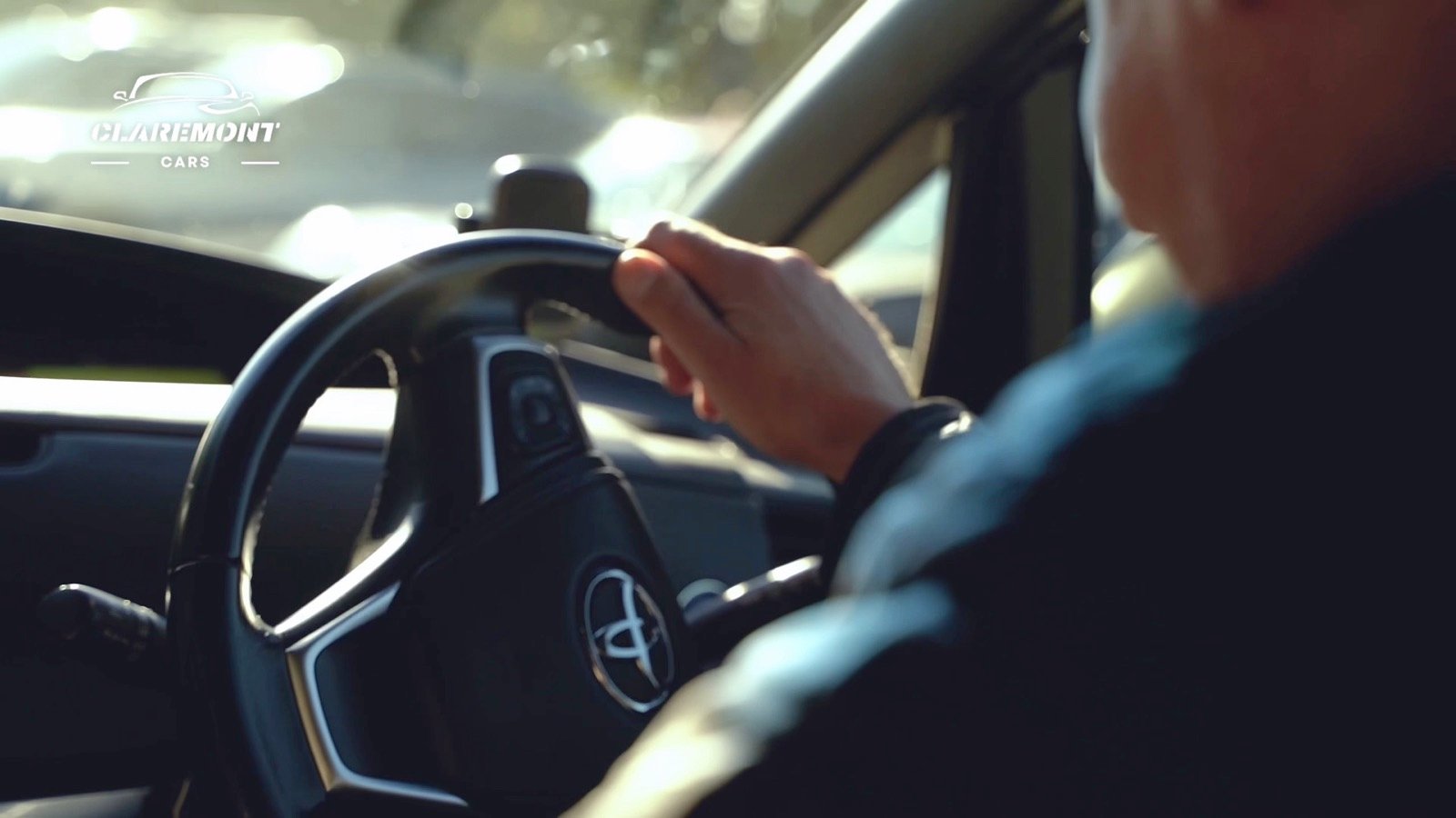 Hands on the wheel of a Mercedes