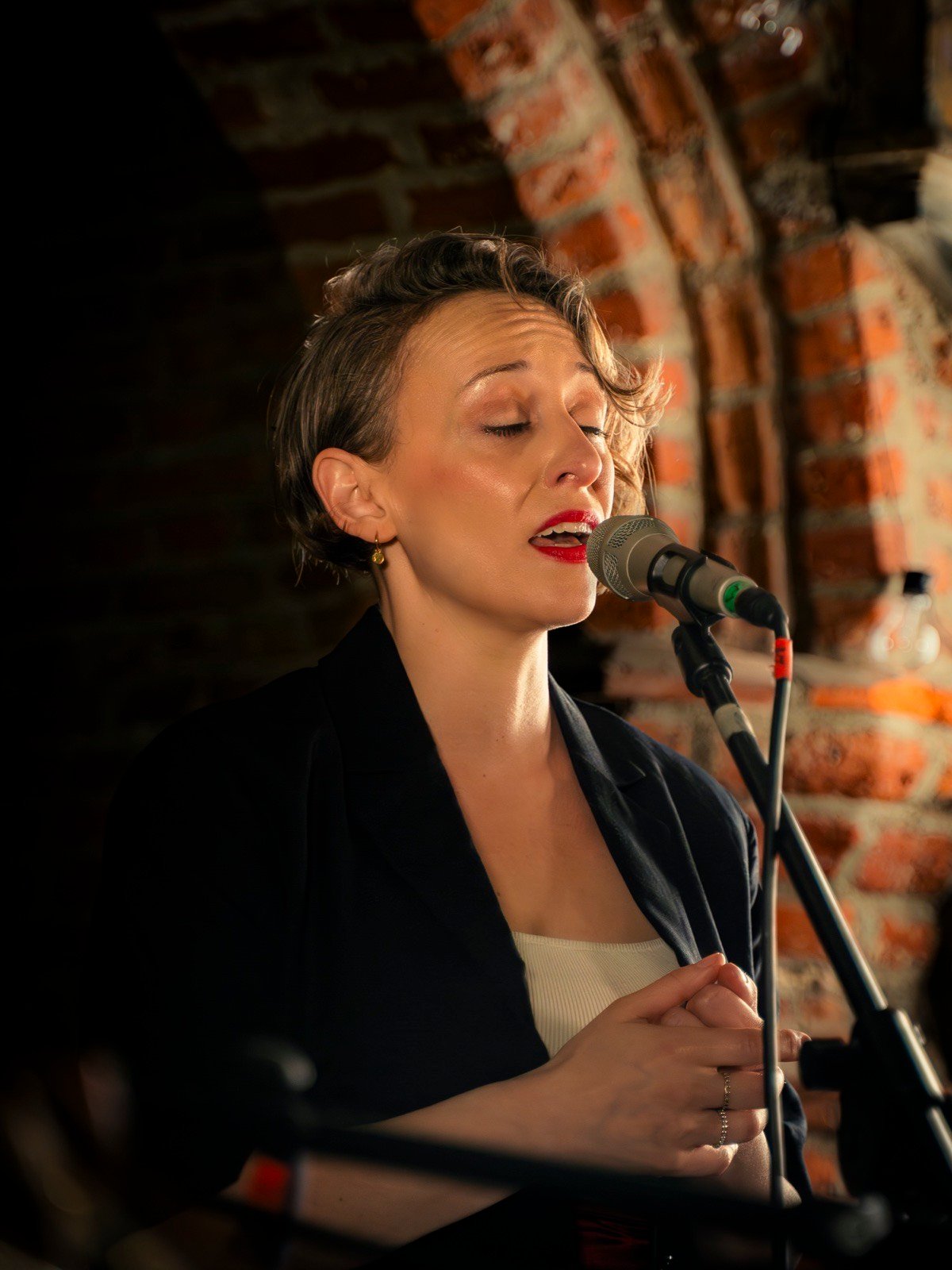 Singing, eyes closed