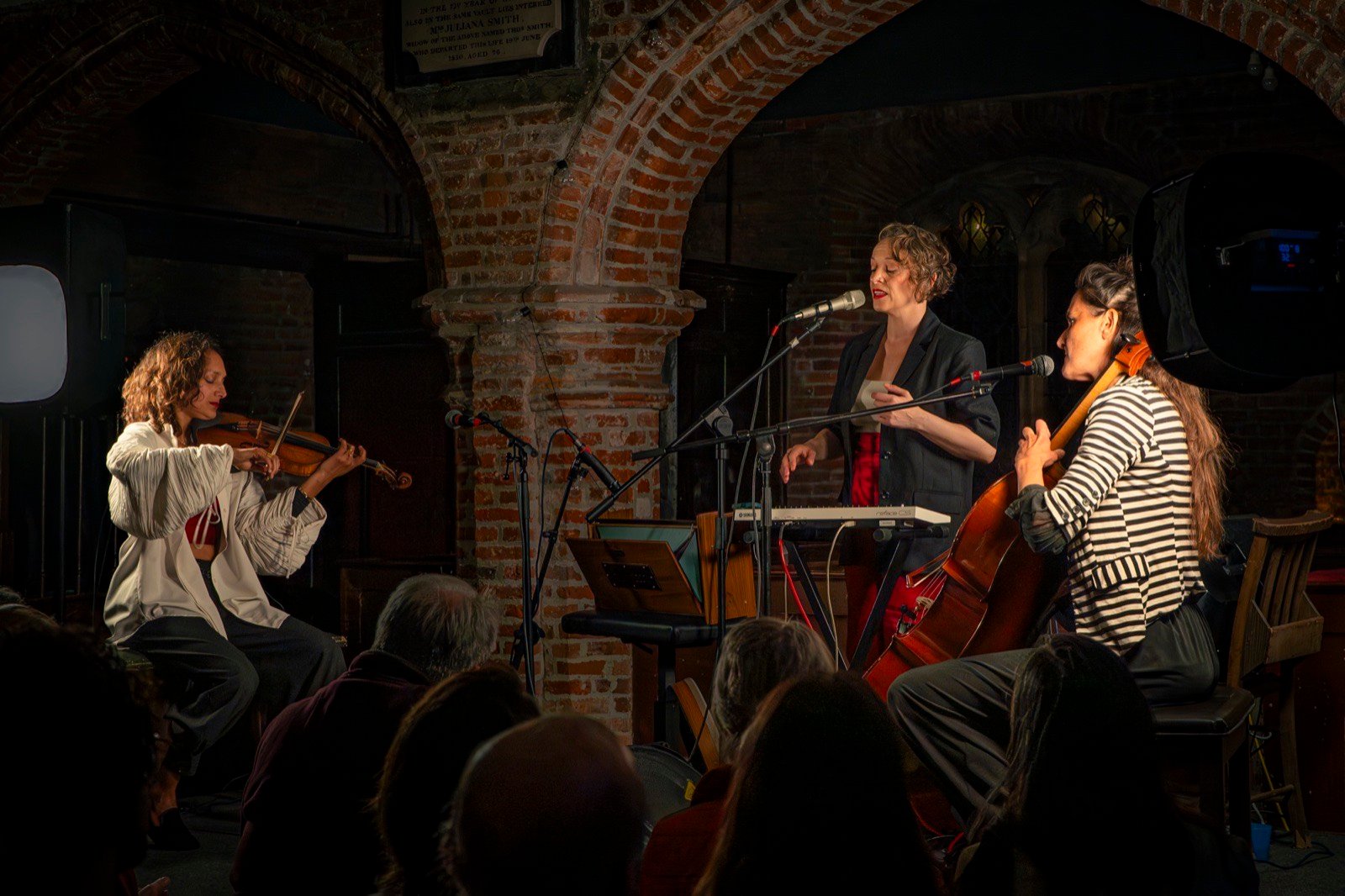 The trio under the brick arches