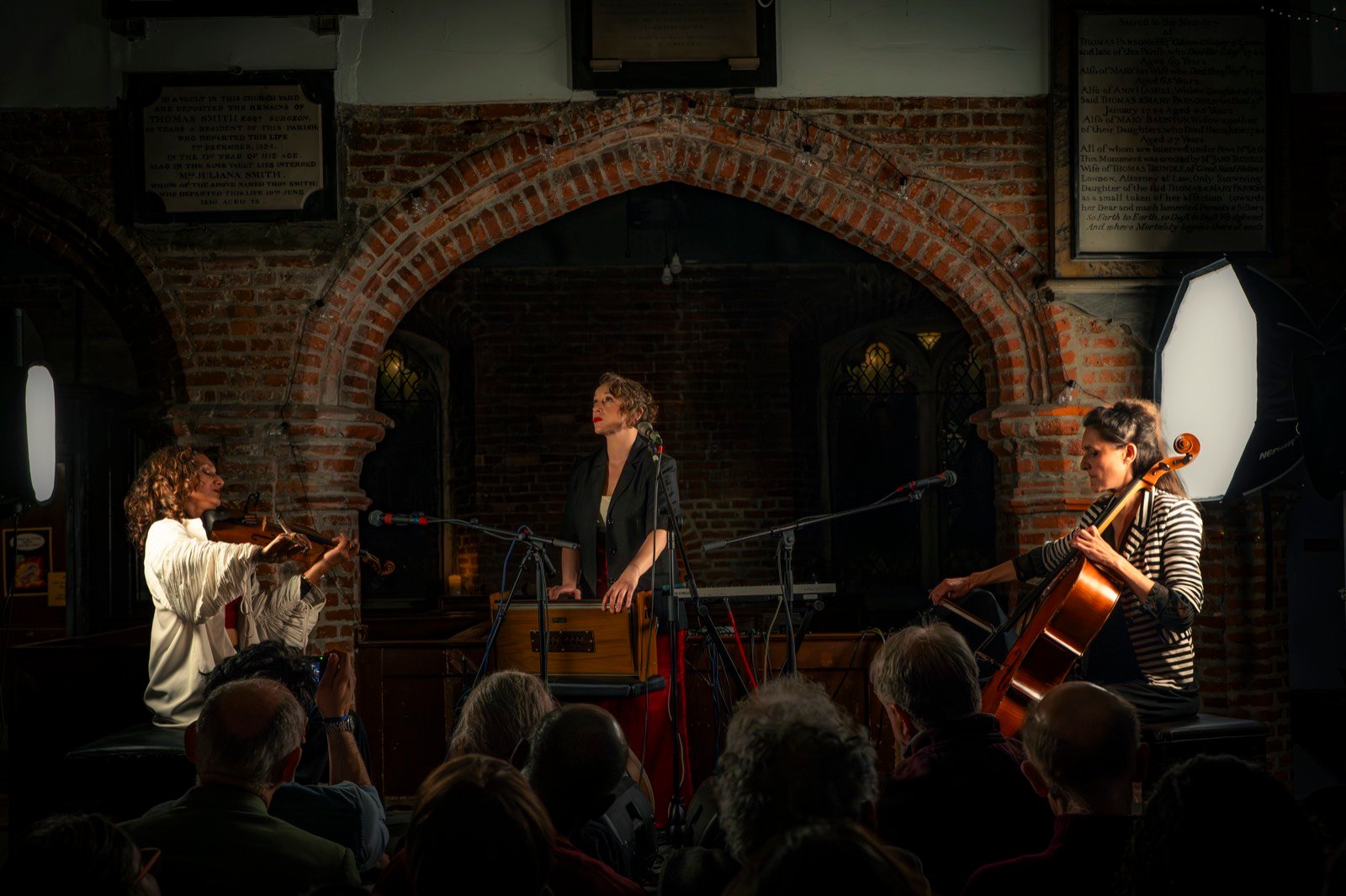 The trio on stage, seen from the audience