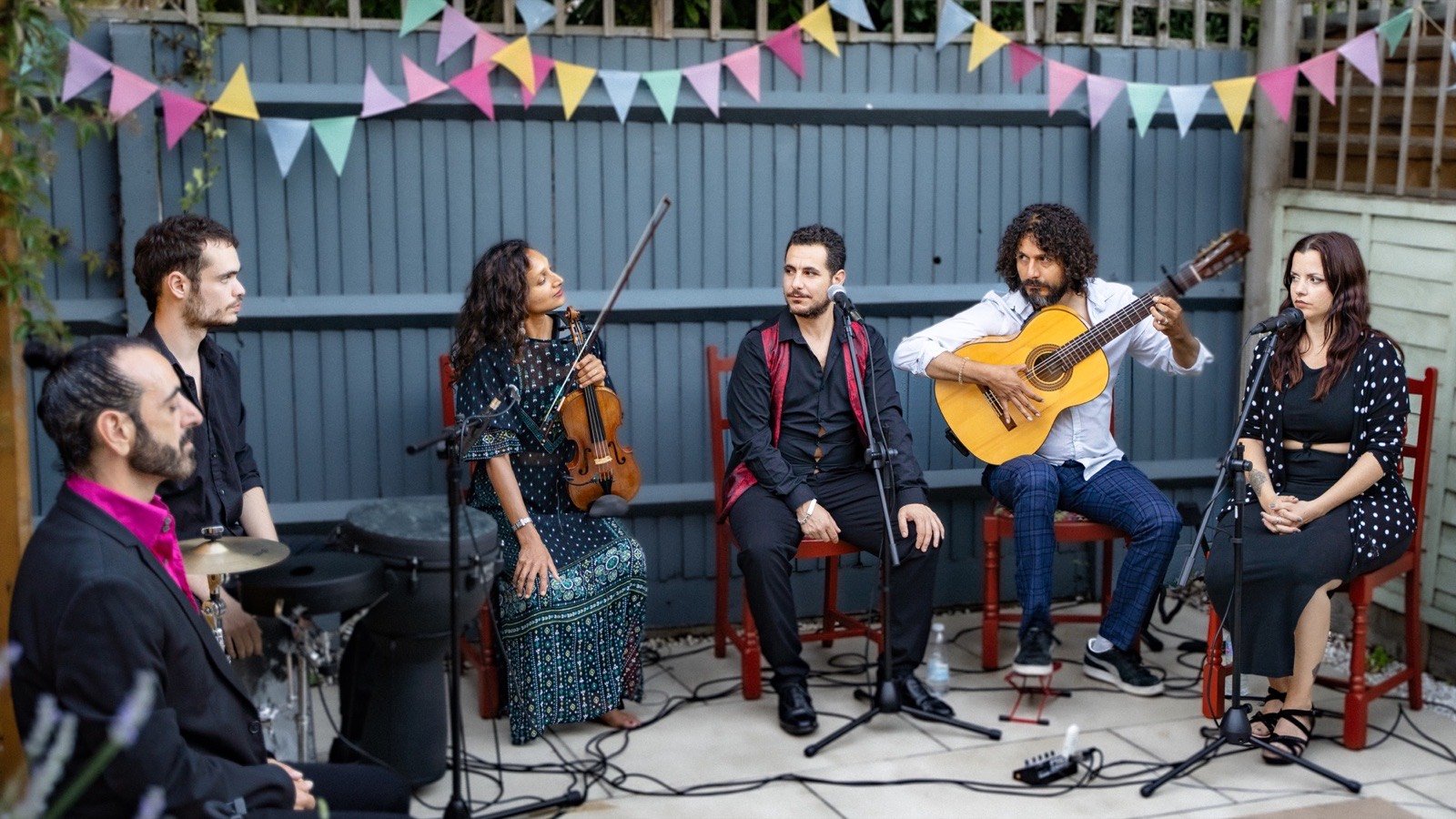 The band in the garden under the bunting
