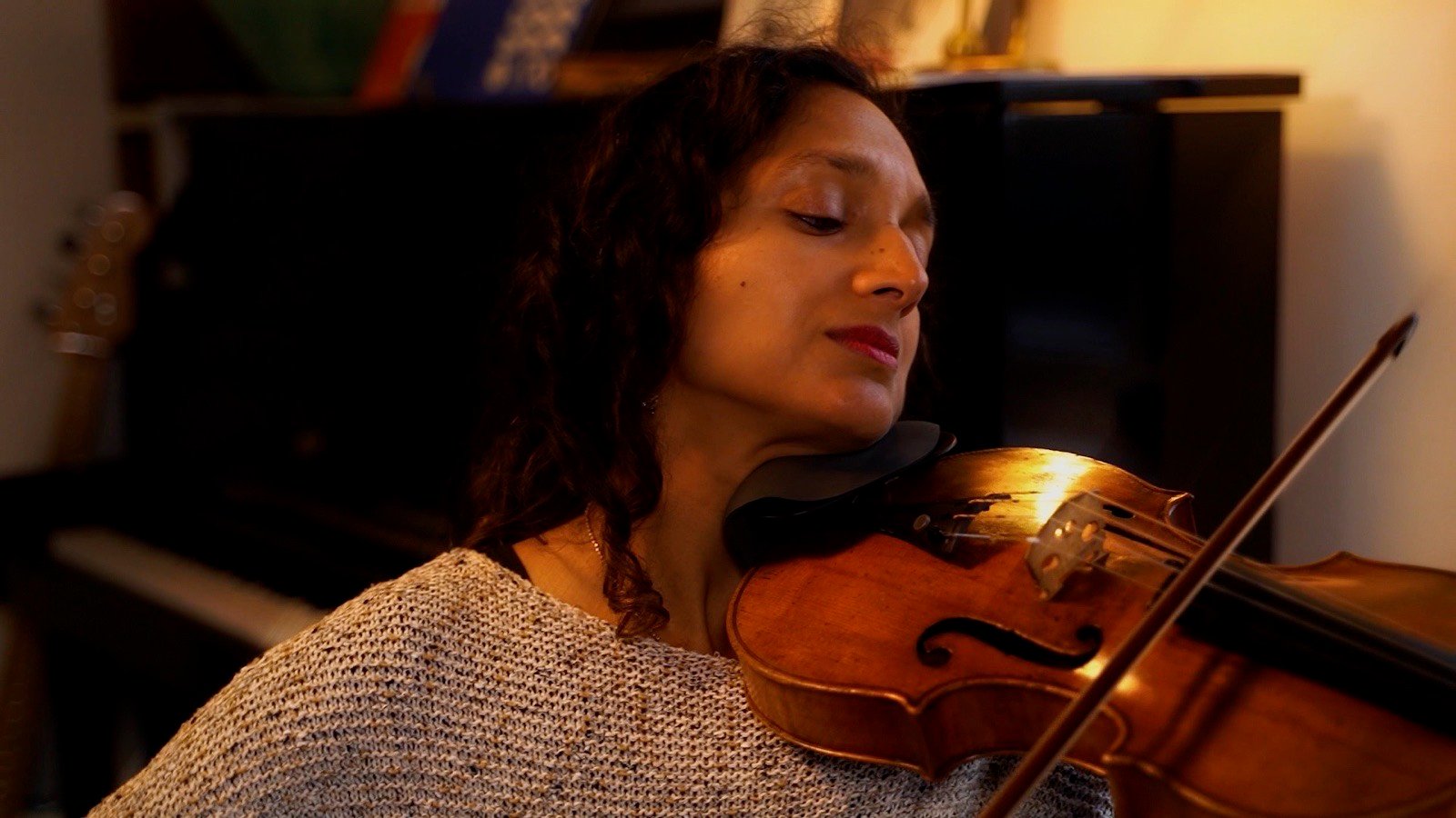The violinist, eyes closed