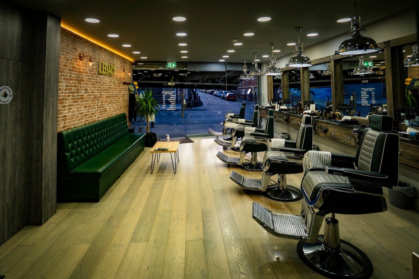 Green leather banquette and the row of chairs