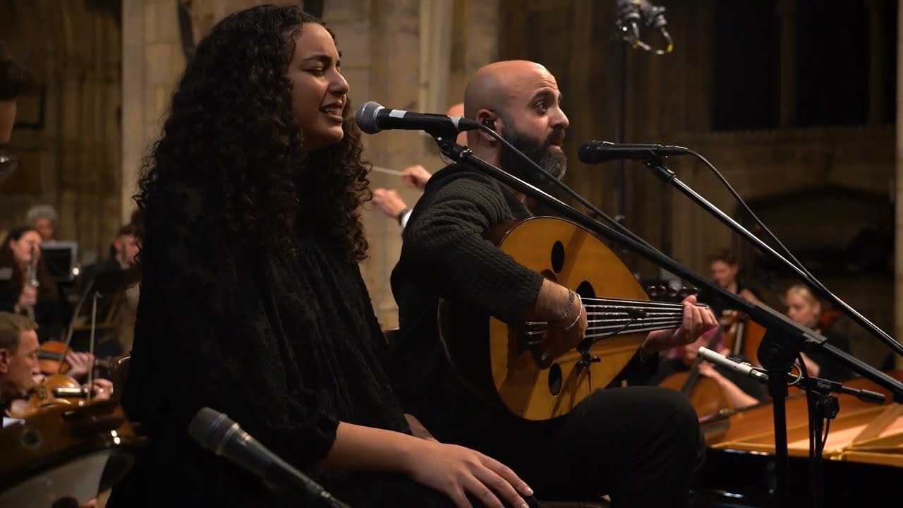 A singer and an oud player with the orchestra in Southwark Cathedral