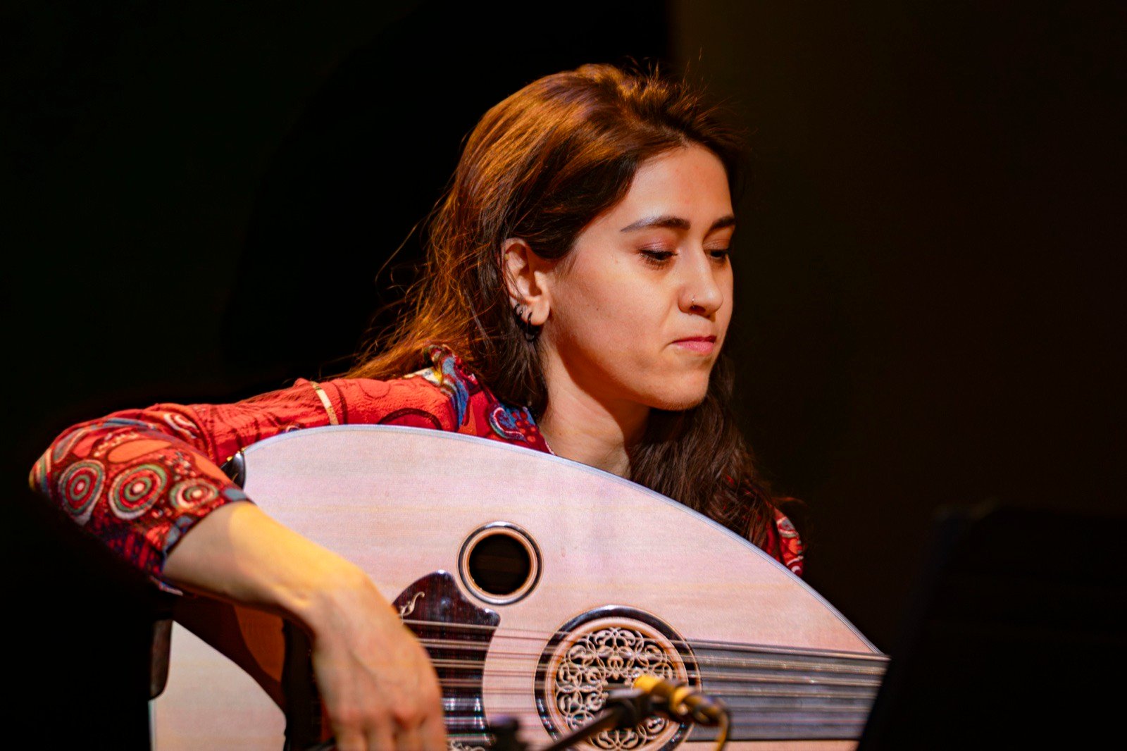 Over the oud, eyes down