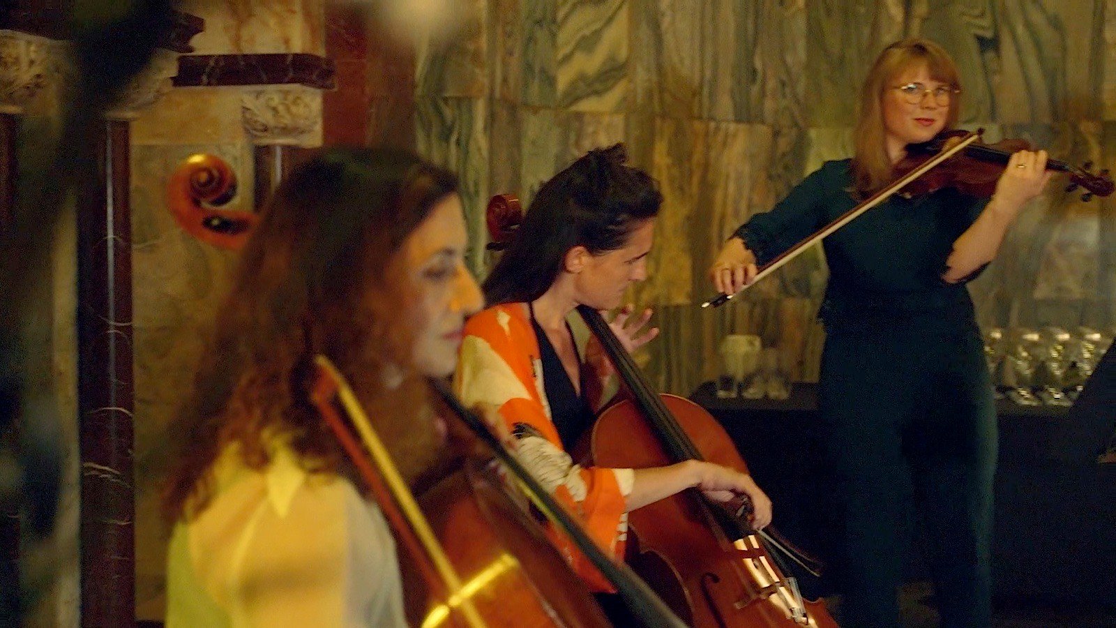 Two cellos and a violin