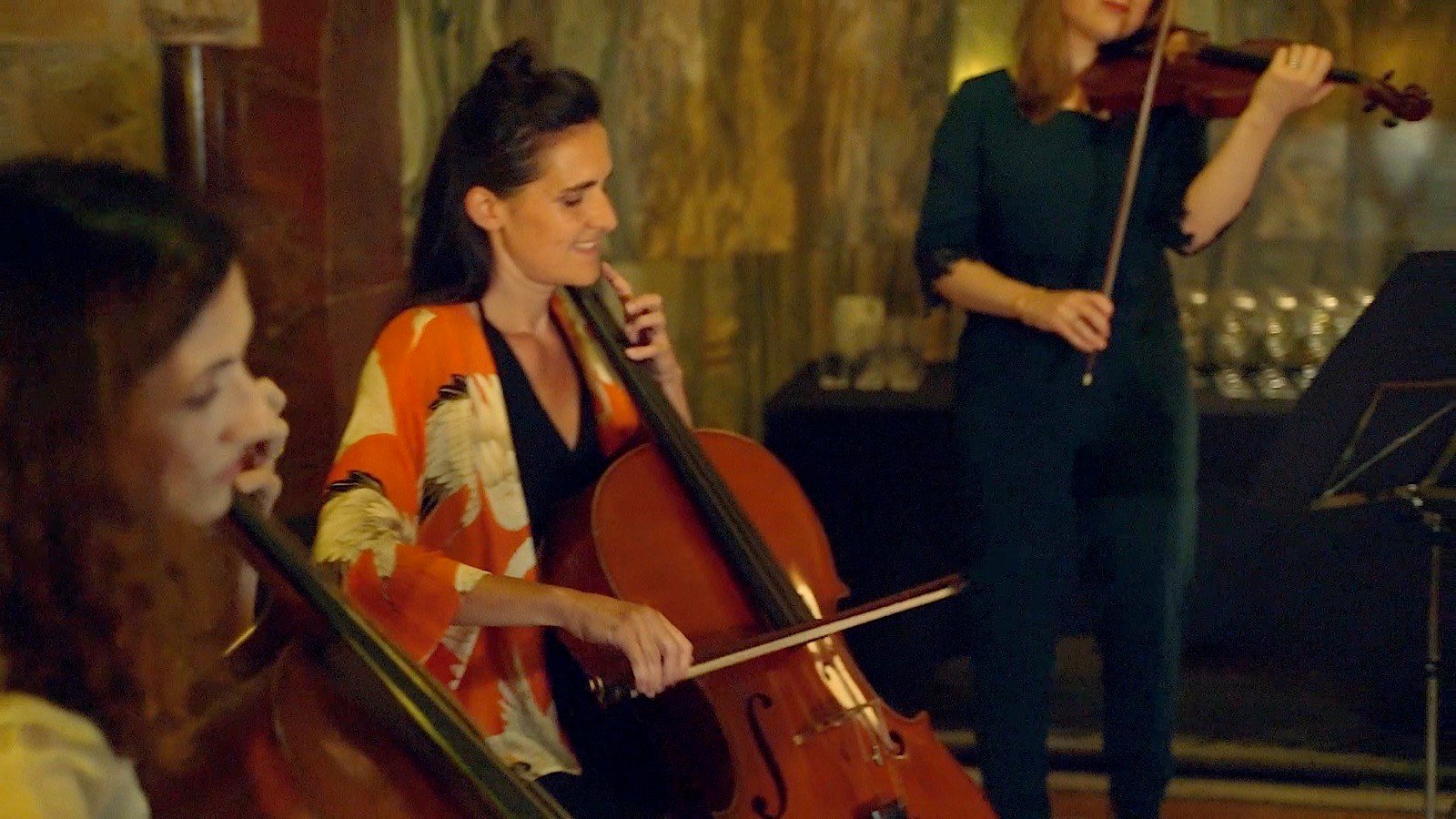 The cellist in an orange shawl