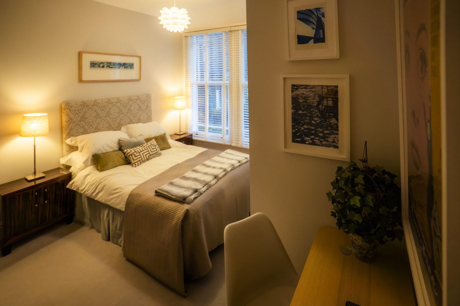 A bedroom in Earl’s Court with a patterned headboard