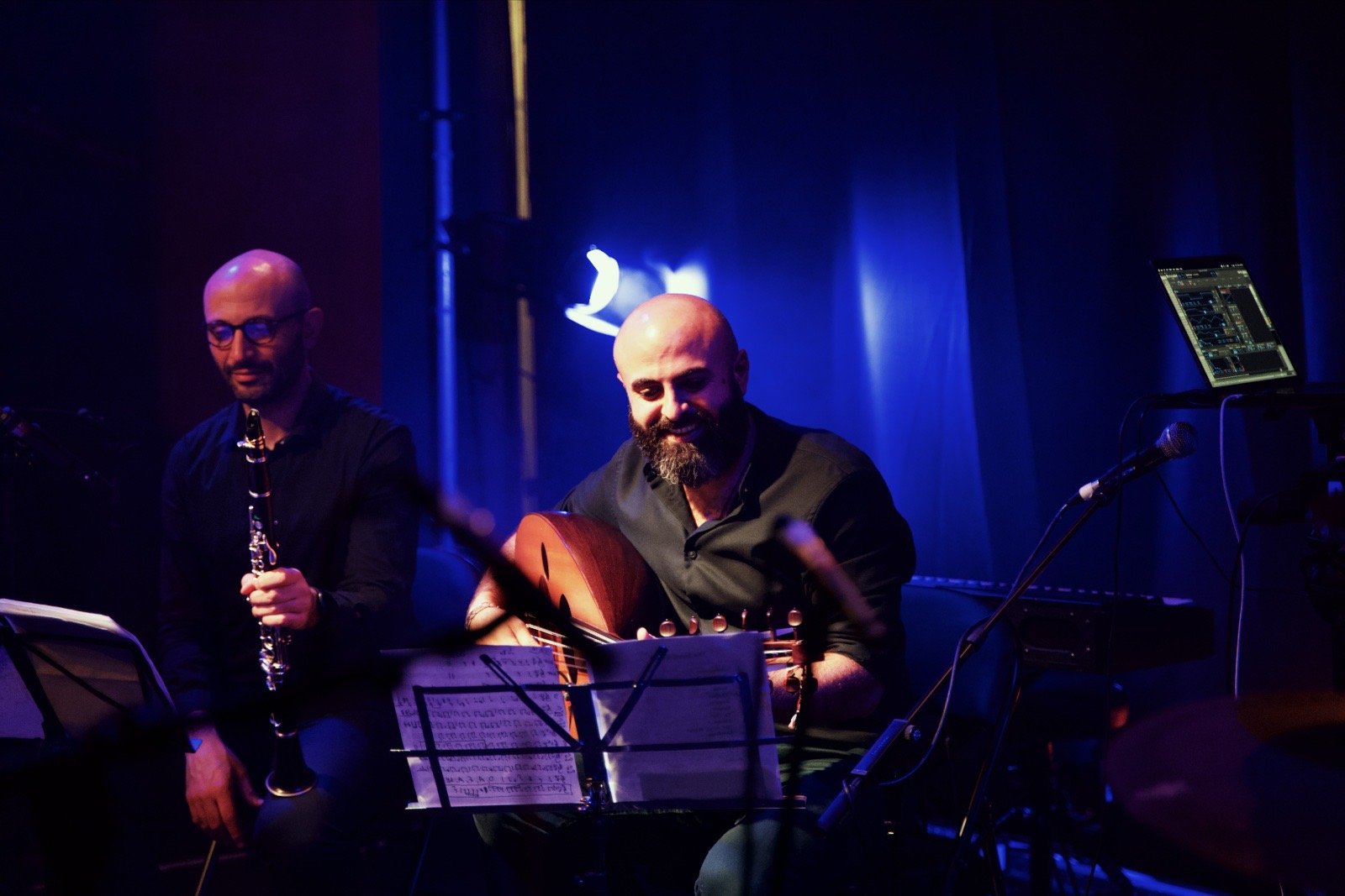 Clarinet and oud in blue light