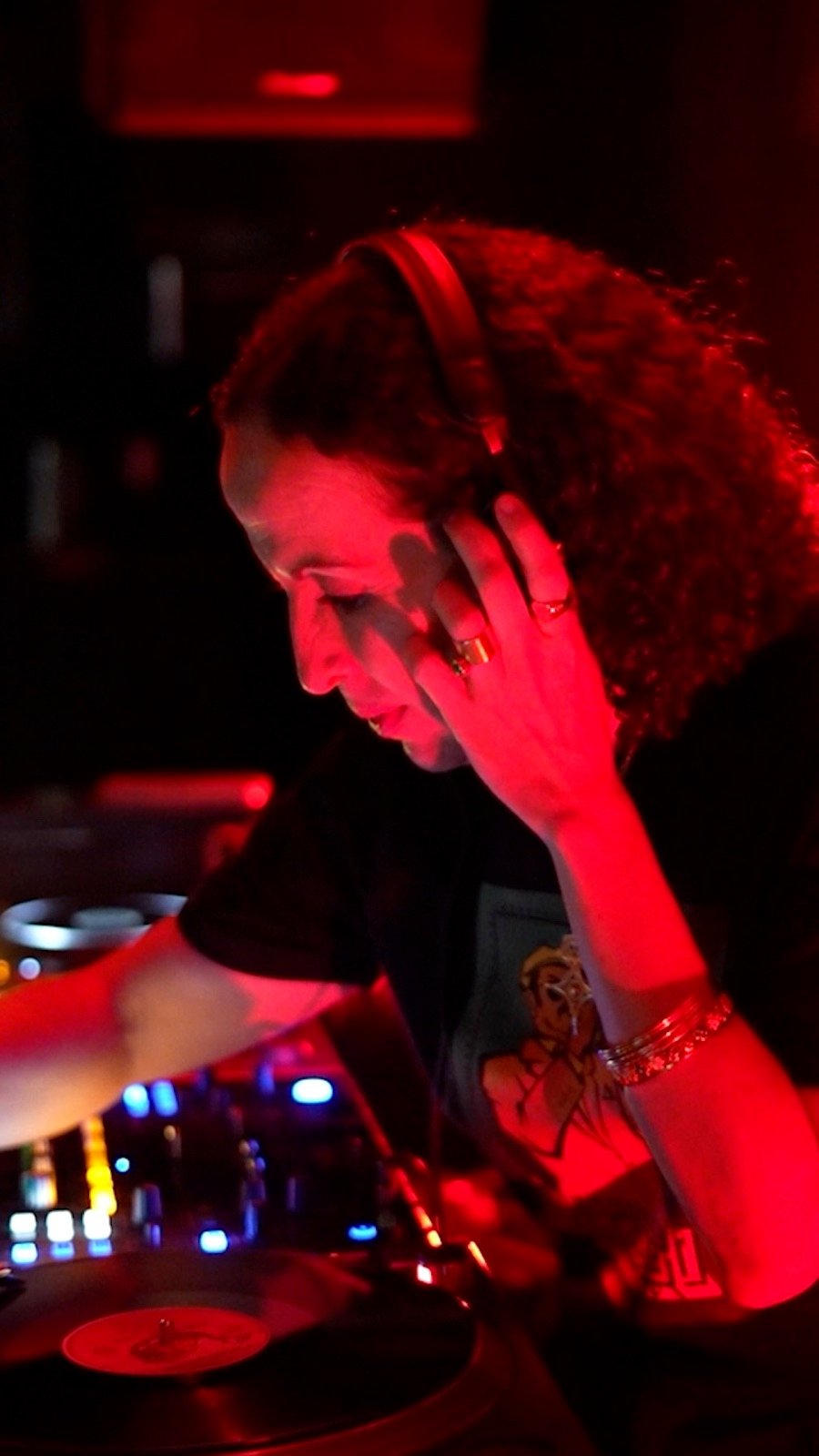A DJ in red light
